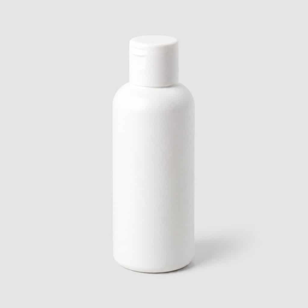Flacon de 100 ml d'huile de massage pour bébé sur fond neutre